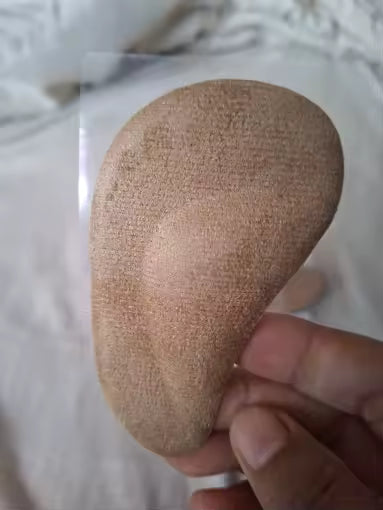 Customer holding arch support insole showing fabric top